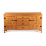 Squirrelman: A Wilfrid Hutchinson (Husthwaite) English Oak Panelled Sideboard, 1969, with raised