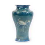 A Royal Worcester Sabrina Ware Vase, by James Southall, painted with swans on a blue ground, printed