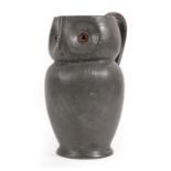 A Liberty & Co, London English Pewter Owl Jug, circa 1902, cast in the form of an owl with glass