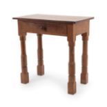 Robert Mouseman Thompson (1876-1955): An English Oak Writing Table, 1940's/50's, the rectangular top