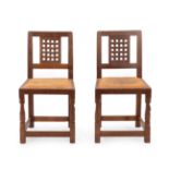 Robert Mouseman Thompson (1876-1955): Two English Oak Lattice Back Dining Chairs, 1940's/50's,