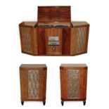 A 1960's/70's Rosewood Radford Radiogram Cabinet, the shaped rectangular top with lift-up lid