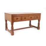 Robert Mouseman Thompson (1876-1955): An English Oak Table/Desk, 1940's/50's, the three plank