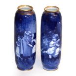 A near pair of Royal Doulton "Blue children" vases, 22.5cm and 22cm high