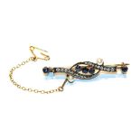 A diamond, cultured pearl and sapphire bar brooch, length 4.4cm. Unmarked. Gross weight 4.9 grams.