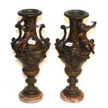 A pair of late 19th/early 20th century bronzed cherub vases