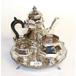 A three-piece Edward VII silver tea-service, by Henry Matthews, Birmingham, 1906, each piece