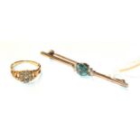 A diamond cluster ring, unmarked, finger size H; and a blue zircon and seed pearl bar brooch,