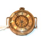 A lady's Continental wristwatch stamped 14k with engine turned decoration