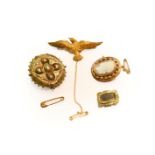 A bird brooch, stamped '15CT', length 5.3cm; a cameo brooch, mount stamped '9CT'; and two