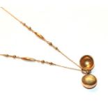 A Victorian ball hair locket on a fancy link chain, length 39cm . Chain with applied plaque