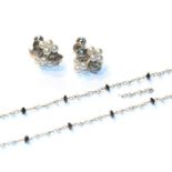 A seed pearl and black stone necklace, stamped '750', length 50cm; and a pair of cultured pearl