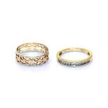 An openwork band ring, stamped '750', finger size O; and an 18 carat gold half hoop ring, finger