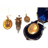 Four Victorian lockets including an oval locket with a star motif formed of an emerald and split