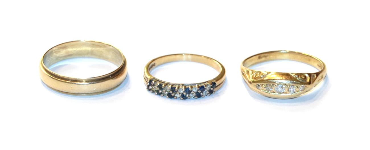 A 9 carat gold sapphire and diamond two row ring, finger size K1/2; a diamond five stone ring,