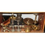 A shelf of assorted brass ware, a bible and pewter ware, etc