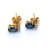 A pair of sapphire and diamond earrings, stamped '18'. Gross weight 2.1 grams.