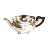A silver tea pot