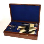 A Walker & Hall oak case EPNS canteen of cutlery