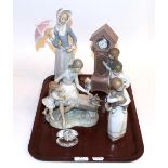 A selection of five Nao and Lladro figures, with a Swarovski crystal and pearl clam (6)