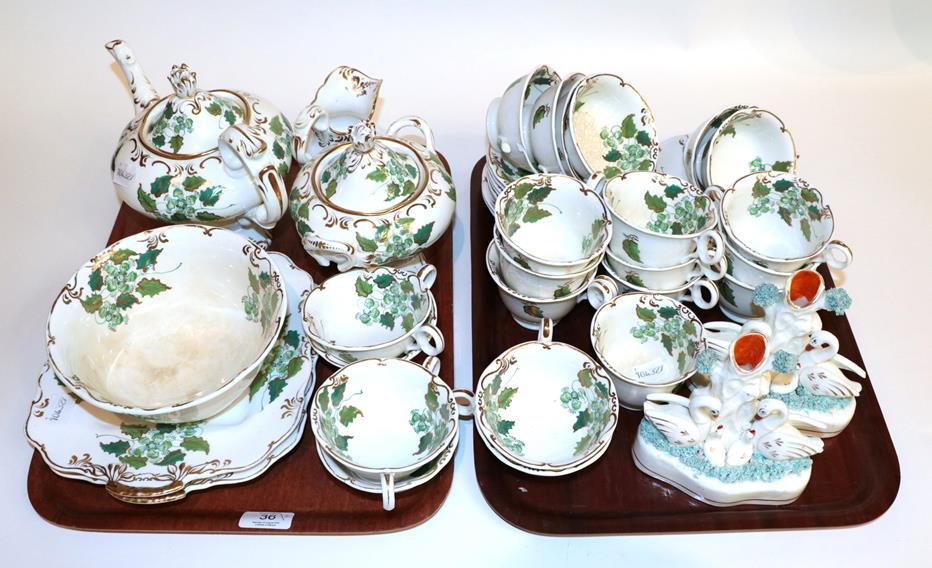 An English tea set, mid-19th century, in the Rockingham style; together with a pair of 19th