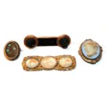 A collection of four brooches comprising of a Victorian tortoiseshell cameo buckle, with three