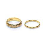 A 22 carat gold textured band ring, finger size M; and a 22 carat gold band ring, finger size K1/
