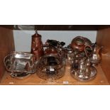 A shelf of assorted plated and copper wares