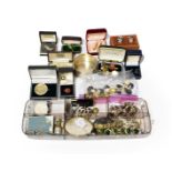 A travelling case of jewellery including various buttons including jet cameo and scarab buttons;