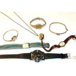 A collection of wristwatches including a Gucci pendant watch with bangle; a bangle watch; a Seiko