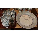 Group of Andrew Hague pottery, including a charger, mugs and jugs and two Scottish cups and saucers