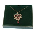 A 9 carat gold garnet and split pearl brooch/pendant on chain, pendant length 4.0cm, chain length