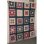 A block patchwork bed cover, incorporating sprigged, plain, checked and striped cottons, 170cm by