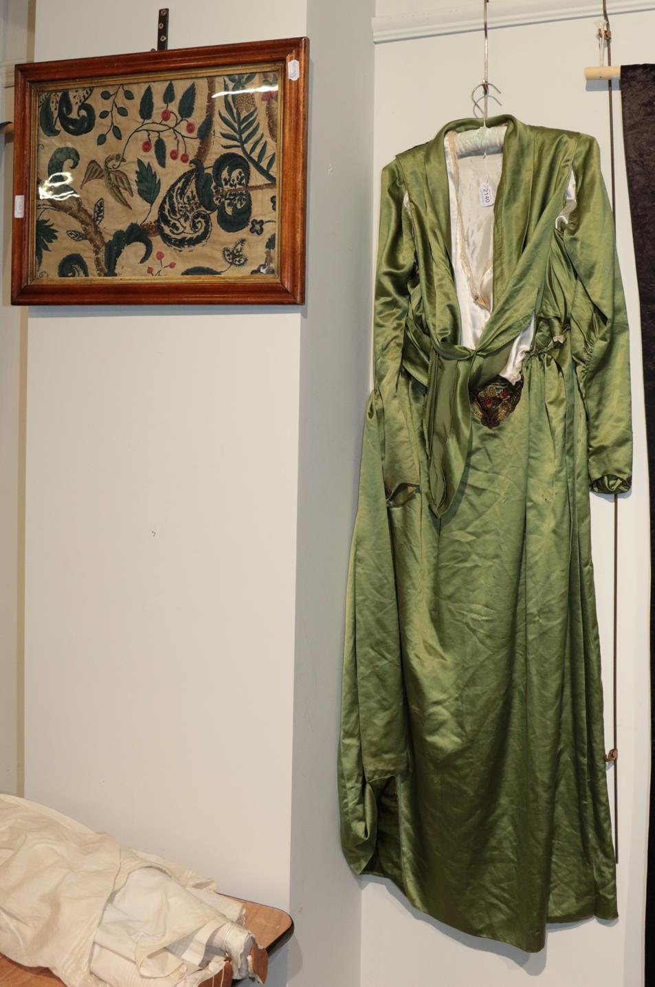 Edwardian green silk dress, in the medieval and Arts and Crafts style; and a 19th century crewelwork