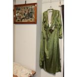 Edwardian green silk dress, in the medieval and Arts and Crafts style; and a 19th century crewelwork