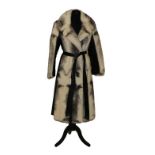 Boutique Furs Ltd, London Black and White Mink Knee Length Coat with black leather inserts and belt.