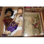 Late 19th century wax head doll with blue glass eyes, blond wig, wearing a purple silk outfit,