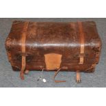 19th century brown leather trunk, hinged and enclosing a blue and white striped cotton lining to the