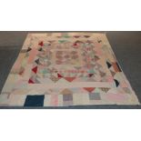 Late 19th century/early 20th century patchwork bed cover, incorporating floral sprigged, checked,