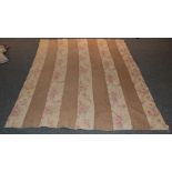 Early 20th century strippy quilt with dark cream and pink floral cotton stripes, cream reverse,