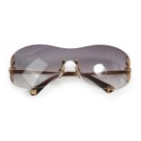 Pair of Louis Vuitton Lily Pattern Rimless Sunglasses, with cut out petals to the side of the