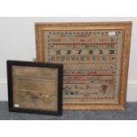 Framed sampler worked by Mary H***is's 1816, with three baskets of flowers holding embroidered