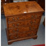 A reproduction burr wood four-drawer bachelors chest with a slide, 66cm wide