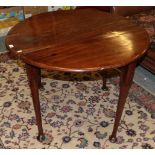 An 18th century mahogany drop leaf table on pad feet