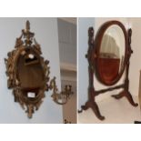 A brass twin-light girandole and a dressing mirror (2)