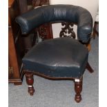 A late Victorian carved mahogany and blue leather horseshoe backed club chair