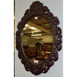 A 19th century carved oak mirror