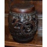 A Chinese carved hardwood barrel seat