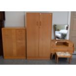 A 1960's G-Plan oak veneered three-piece bedroom suite, a similar stool and a single dining chair