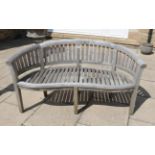 A curved garden bench